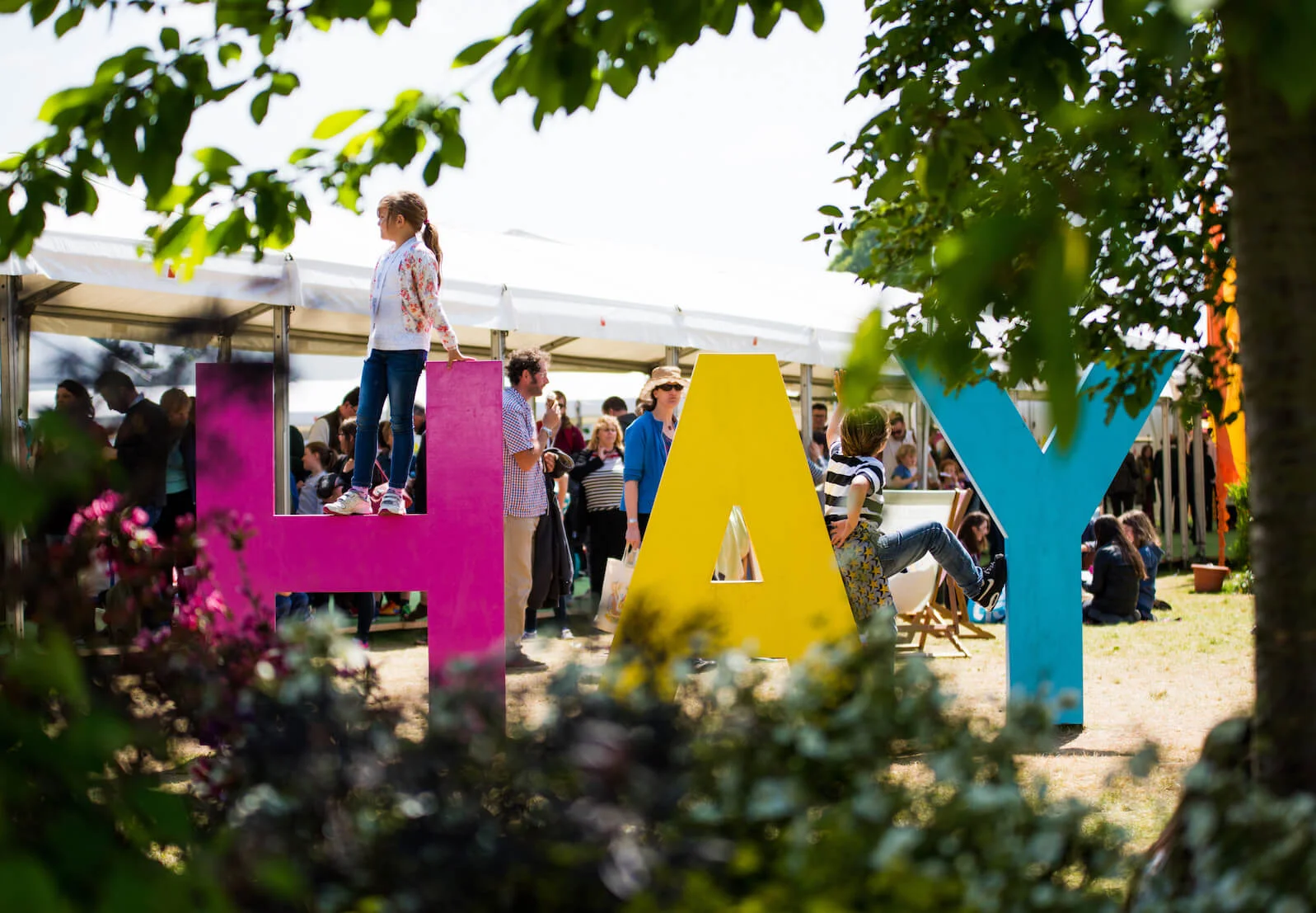 large colourful letters spelling hay at the hay on wye festival