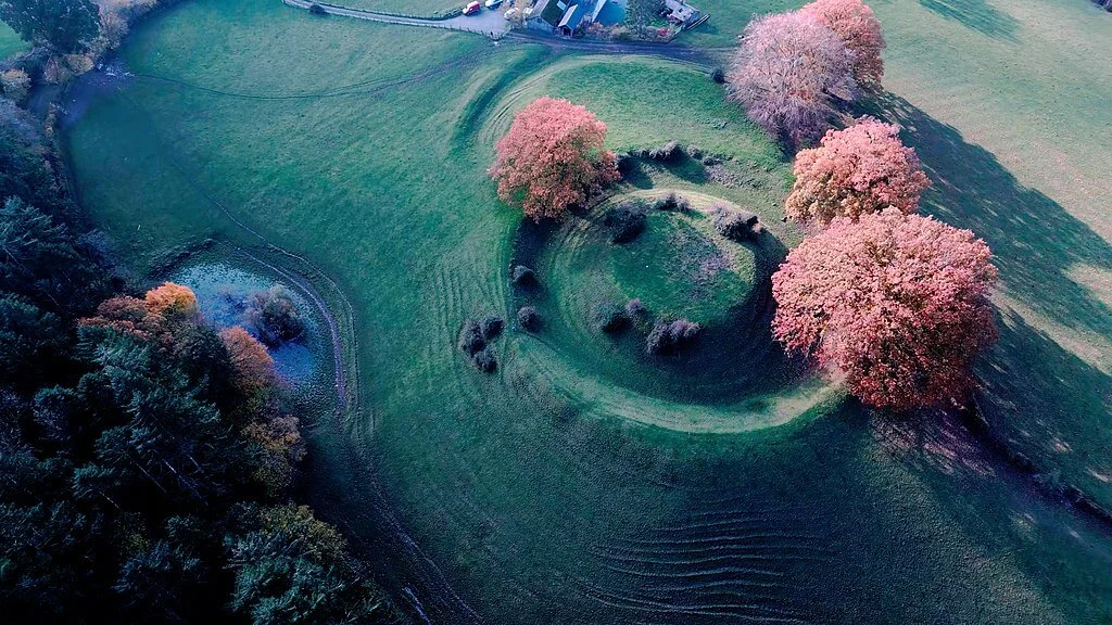 aerial shot of a hill with the impression of an old fort